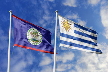 3d illustration. Belize and Uruguay Flag waving in sky. High detailed waving flag. 3D render....