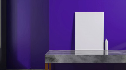 A minimalist designera??s workspace, with a blank frame on a grey polished table against a striking deep purple wall.