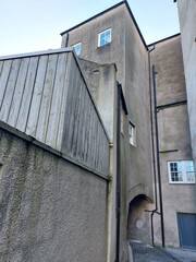 Narrow street with old stone buildings