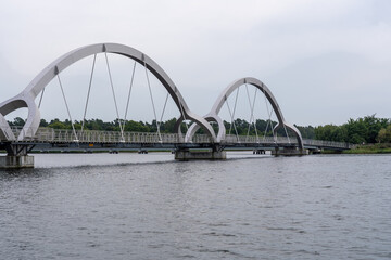 Vast city bridge connects to another over water in the urban landscape, Sweden, Soelvesborg