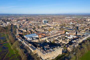 Aerial photo of the town centre of Harrogate North Yorkshire in the UK, showing a drone view of the whole of the town centre in the winter time on a sunny day
