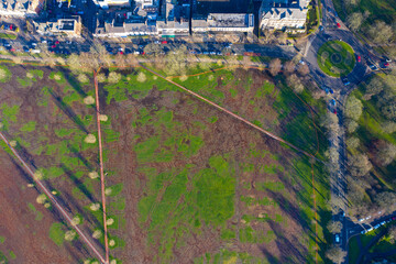 Aerial photo of the town centre of Harrogate in the UK showing a muddy playing field known as the...