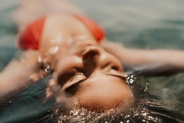 Happy woman sea relaxing floating in transparent sea water on summer holiday. Travel leisure...