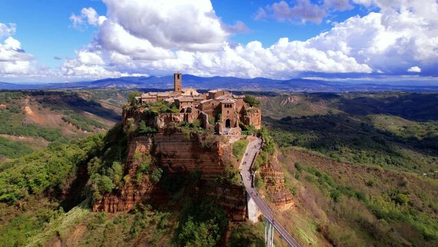 4K Aerial Drone View of Civita di Bagnoregio the Dying City. Cinematic Medieval Ghost Town on Tufa Rock Plateau with Bridge Access. Lazio Viterbo Italy. High Quality Video