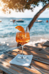 A classic spritz cocktail by the water in the summer