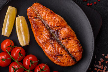 Fresh cooked delicious salmon steak with spices and herbs