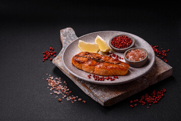 Fresh cooked delicious salmon steak with spices and herbs