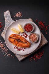 Fresh cooked delicious salmon steak with spices and herbs