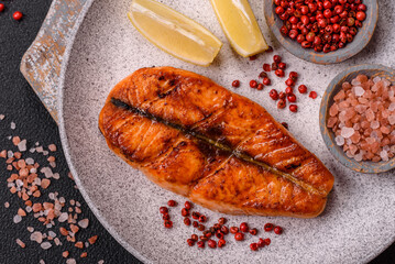 Fresh cooked delicious salmon steak with spices and herbs
