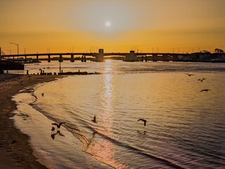 Obraz premium Aerial view of The Atlantic Beach Bridge, during a golden sunrise