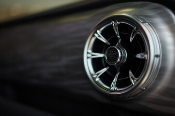 Closeup of car dashboard air vents near gear shift