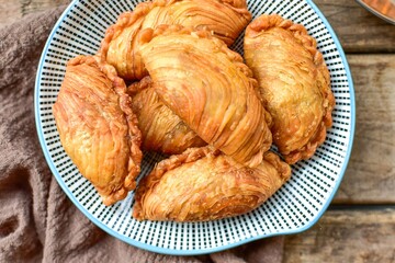 curry puff , karipap wooden blackground retro style	
