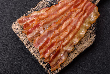 Delicious bacon in the form of slices with salt, spices and herbs