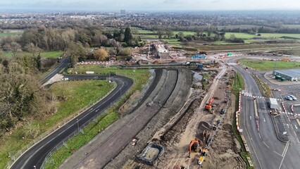 an aerial view of an empty freeway with the construction site and the grass covered streets