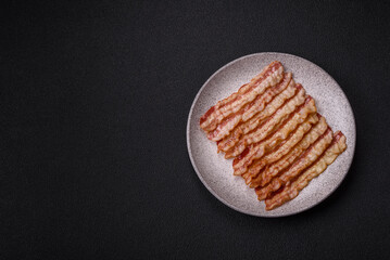 Delicious bacon in the form of slices with salt, spices and herbs