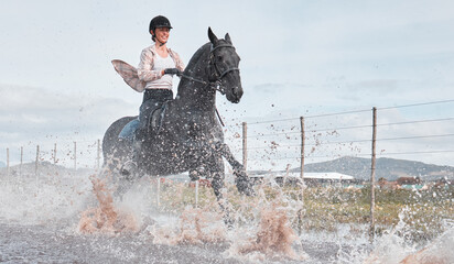 Woman, countryside and horse for equestrian sport in nature, stallion and riding hobby on ranch in...