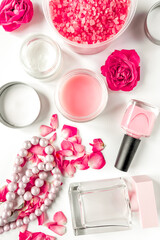 rose salt and cream for nail care in spa on white background top view