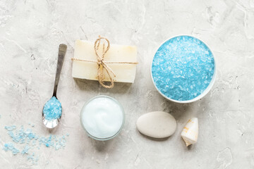 spa composition with blue salt and soap on stone background top view mockup