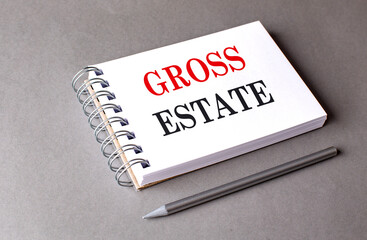 GROSS ESTATE text on notebook on grey background