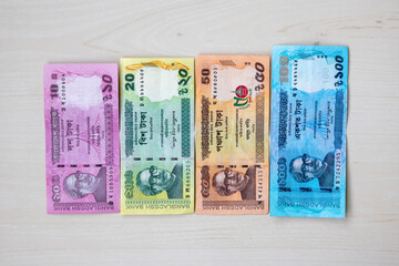 Bangladesh bank taka paper note currency isolated on wooden background. Bangladeshi four BDT...