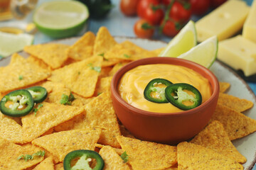 Corn tortilla chips with cheese sauce