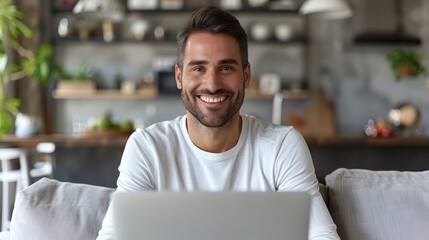 Fototapeta premium A man sitting on a couch, focused on a laptop screen, typing and scrolling. Modern technology and relaxation concept