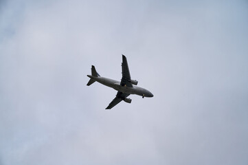 Airplane in the sky in cloudy weather
