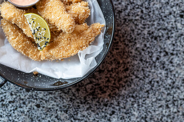 golden deep-fried battered chicken nuggets.succulent chicken chunks ensconced in a delectable...