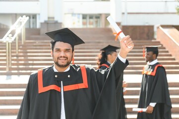 education, graduation and people concept - happy Indian Male graduate student
