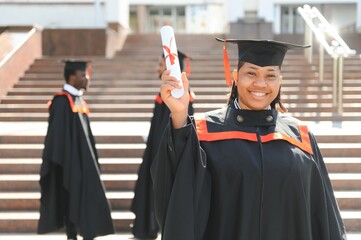 pretty african female college graduate at graduation