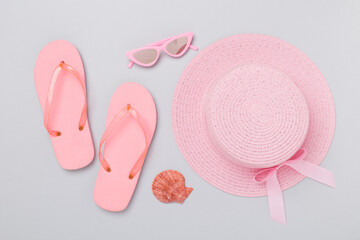 Flat lay with pink summer outfit on color background. Vacation concept