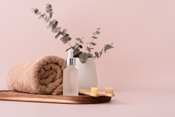 Bath towel, serum bottle and bamboo toothbrushes