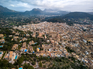 Naklejka premium Aerial view of Pollenca in Mallorca, drone photo in cloudy day
