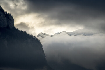 dark, atmospheric and mystical mountains shrouded in clouds