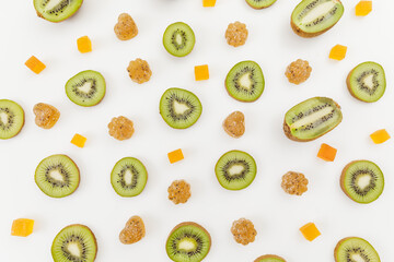 Candied fruit jelly with kiwi fruits on white. Flat lay, top view.