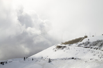 Mountain winter landscape. Mount Grappa war memorial building view