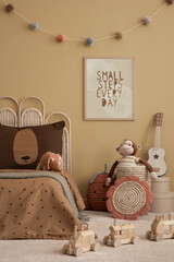 Aesthetic composition of child room interior with mock up poster frame, braided basket, guitar, wooden block toys, plush monkey, colorful garland and personal accessories. Home decor. Template.