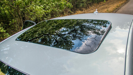 Slightly open sunroof on a car close-up