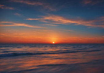 Fototapeta na wymiar Ocean View at Sunset_ Sky Ablaze with Orange Hues Above the Tranquil Blue Sea.