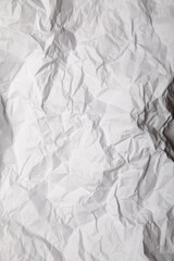 Piece of white wrinkled paper texture background 