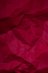 Piece of red wrinkled paper texture background 