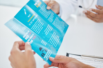 Medical, brochure and hands of doctor with patient in hospital for consulting, health information or virus. Safety, pandemic and GP with advice for disease, protection or covid vaccination in clinic