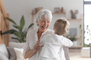 Fototapeta premium Elderly woman hugging young girl at home, showing love, affection, and generational bonding, happy family moment.