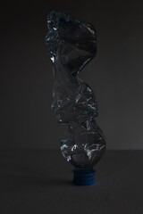 water bottle, rumpled, glows like crystal or ice