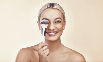 Smile, portrait and woman with makeup brush in studio for beauty, self care and natural routine....