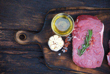 Top view raw beef tender meat steak grill pork barbeque on wooden board. Steak western cuisine...