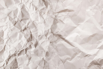 Crumpled white paper background.
