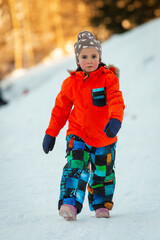 Cute little girl playing in the snow