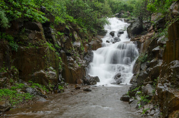 Fototapeta premium Waterfall in the forest at Bhor, Maharashtra, India.