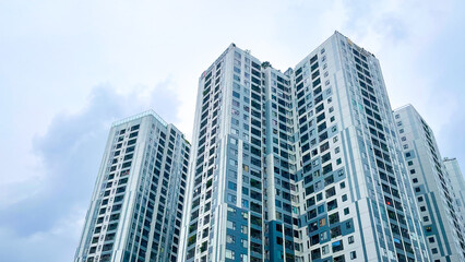 Apartment building with cloudy background sky